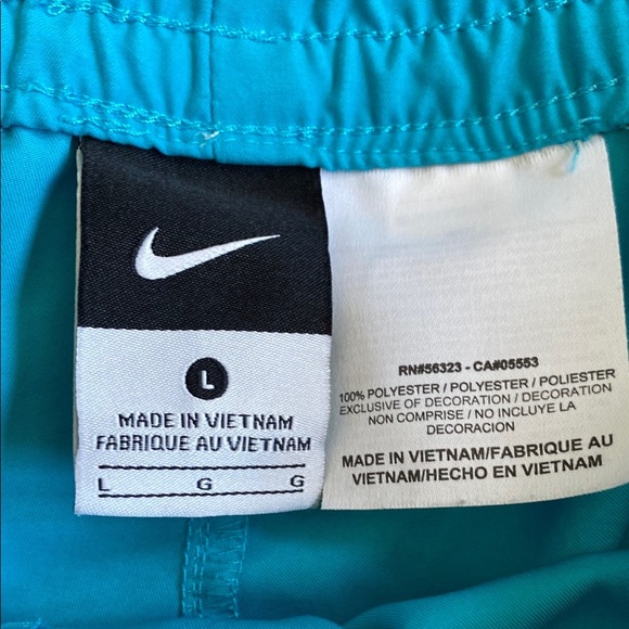 Bright turquoise with white side stripe Nike shorts with pockets, size women’s L - Picture 3 of 16